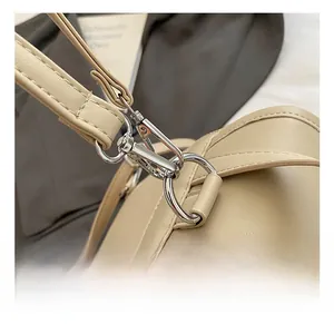 Detail of high-quality silver metal hook and premium lychee pattern leather strap