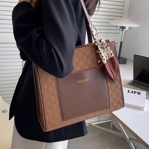 Brown vintage tote bag with checkerboard pattern and leopard print scarf handle decoration