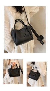 Black pebble leather bucket bag with elephant charm shown in three carrying styles