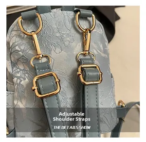 Detailed view of adjustable leather straps and golden hardware on the butterfly backpack