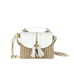Straw woven crossbody bag with white leather flap and tassel details on white background