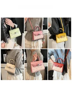 Detail showing various colors of small square crossbody bags with cartoon embossing and metal locks