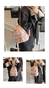 Détail du mini sac à dos rose avec broderie florale 3D et accessoires en métal doré