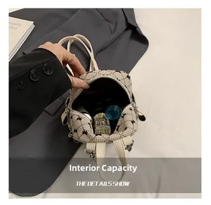 Internal view of mini checkered backpack with bow embroidery showing perfume and lipstick