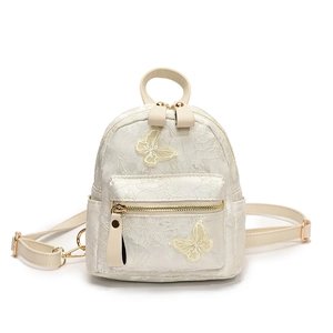 Mini sac à dos en jacquard floral avec broderie papillon et fermetures éclair dorées