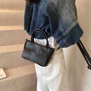 Fashionable black woven crossbody bag with gold hardware and top handle for women