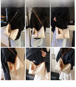 Vues détaillées sous plusieurs angles d'un sac hobo ivoire avec finitions en cuir marron