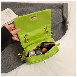 Internal view of neon green quilted crossbody bag showing space for phone and makeup