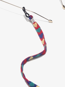 Detail of colorful heart pattern eyewear strap with rubber loop on gold frame glasses