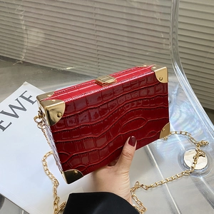 Red crocodile texture box clutch with golden chain strap and metallic hardware