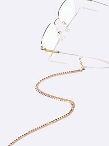 Détail d'une chaîne de lunettes dorée avec petits disques et boucles antidérapantes