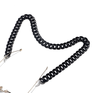 Fashionable black acrylic link eyewear chain with gold metal hooks on white background