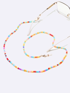 Detail of colorful seashell beaded eyeglass chain with gold clasps and silicone loops