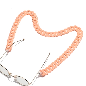 Detail of peach acrylic eyewear chain with thick oval links and silicone loops