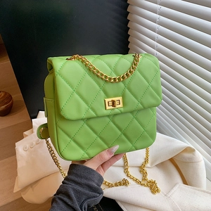 Bright green quilted crossbody bag with gold chain strap and turn-lock closure