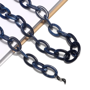 Detailed macro of dark blue marble texture acrylic links on a non-slip eyewear chain