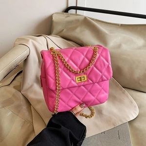 Hot pink quilted leather shoulder bag with gold chain strap and metallic turn-lock