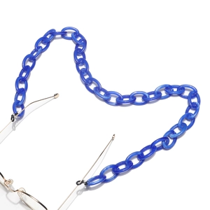 Detail of navy blue acrylic chunky link eyeglass chain with black rubber connectors