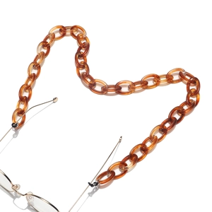 Amber acrylic eyewear chain in heart shape with tortoise shell texture detail