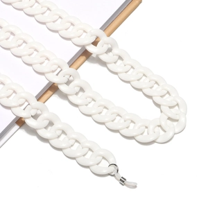 Detailed close-up of white resin eyeglass chain with silver rings and silicone loops