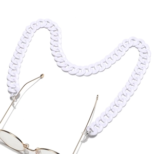Close-up of white acrylic thick chain glasses strap with gold metal hooks and rubber loops