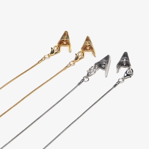 Detail of gold and silver snake chain alligator clips for glasses and masks