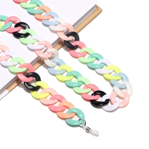 Macro shot of colorful acrylic chain links with adjustable silicone loop and metal ring
