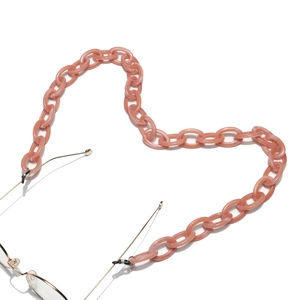 Close-up of pink acrylic link eyewear chain with black anti-slip rubber loops