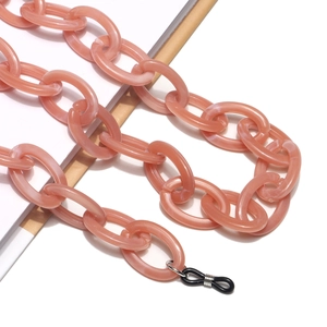 Detailed close-up of pink acrylic chain link for glasses with non-slip rubber loop