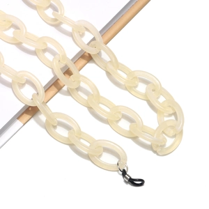 Detailed close-up of cream resin chain link with rubber loops for glasses