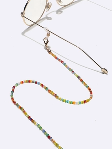 Detail of colorful beaded glasses chain with silicone loops and gold lobster clasps