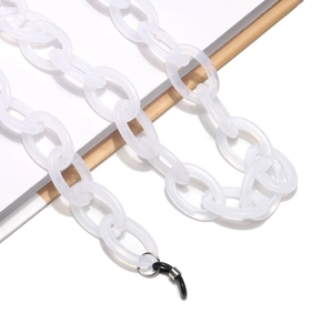 Close-up of translucent white acrylic eyeglass chain links with silver metal connector