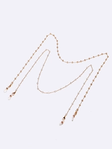 Détail des chaînes de lunettes faites main en perles d'ambre et cristal avec liens dorés
