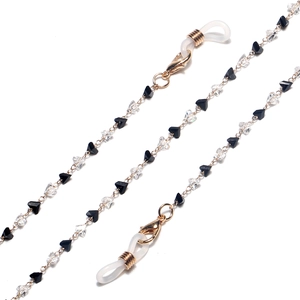 Golden eyewear chain featuring black and white triangle crystals and lobster clasps
