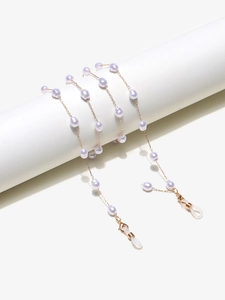 Detail of golden glasses chain with lavender pearls and adjustable rubber loops