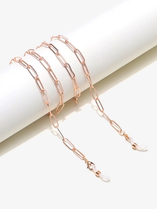 Vue détaillée de la chaîne à lunettes trombone en or rose avec connecteurs en silicone