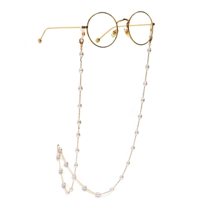 Golden round glasses with a delicate pearl neck chain on a clean white background