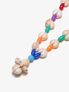 Detail of bohemian handmade colorful beaded eyewear chain with natural seashell pendant