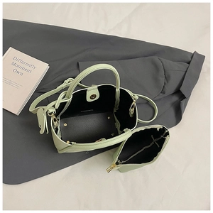 Top view of mint green bucket bag showing internal structure and matching inner pouch