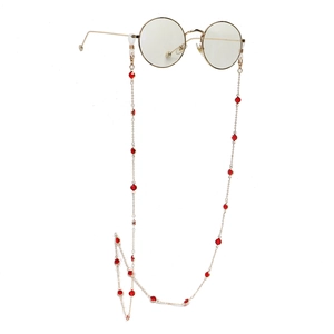Handmade golden alloy eyeglass chain featuring red glass beads for stylish eye wear decoration