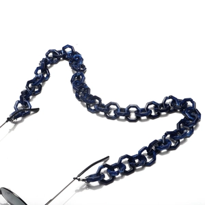 Detail of dark blue marble acrylic glasses chain with hexagonal links and rubber loops