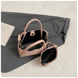 Pink litchi leather bucket bag set with inner pouch and gold-toned metal hardware