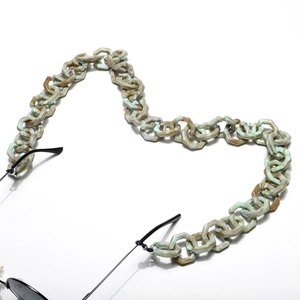 Detailed heart-shaped layout of marble textured acrylic glasses chain in green and brown