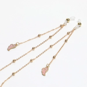 Golden metal eyewear chain with pink enamel wings and decorative round beads