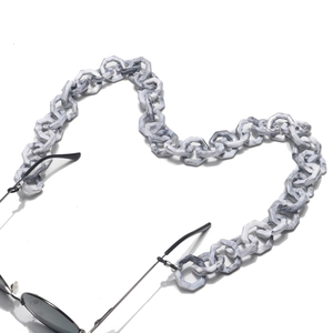 Close-up of thick hexagonal gray marble acrylic links on a stylish glasses chain