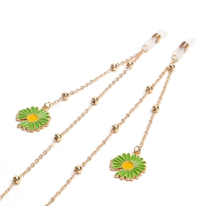 Catenella per occhiali dorata con ciondoli a margherita verde e perline metalliche