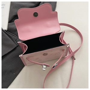 Detailed interior of the pink cartoon crossbody bag with magnetic clasp and shoulder strap