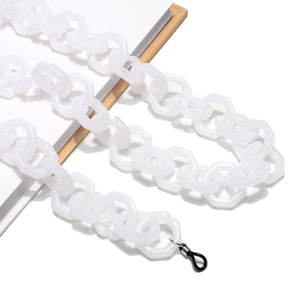 Detail of translucent white acrylic chain link with black rubber ends and silver metal rings