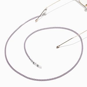 Detail of light purple spiral metal eyeglass chain with clear anti-slip silicone loops