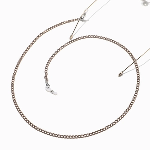 Detail of light gold metal eyewear chain with white silicone anti-slip loops and lobster clasp